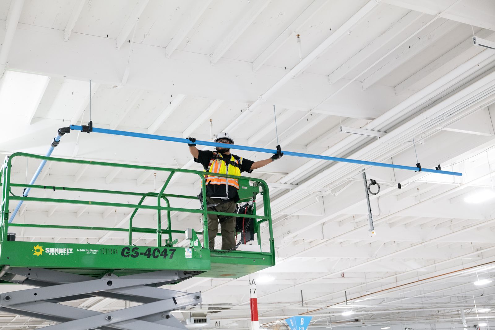 Technician working safely at height